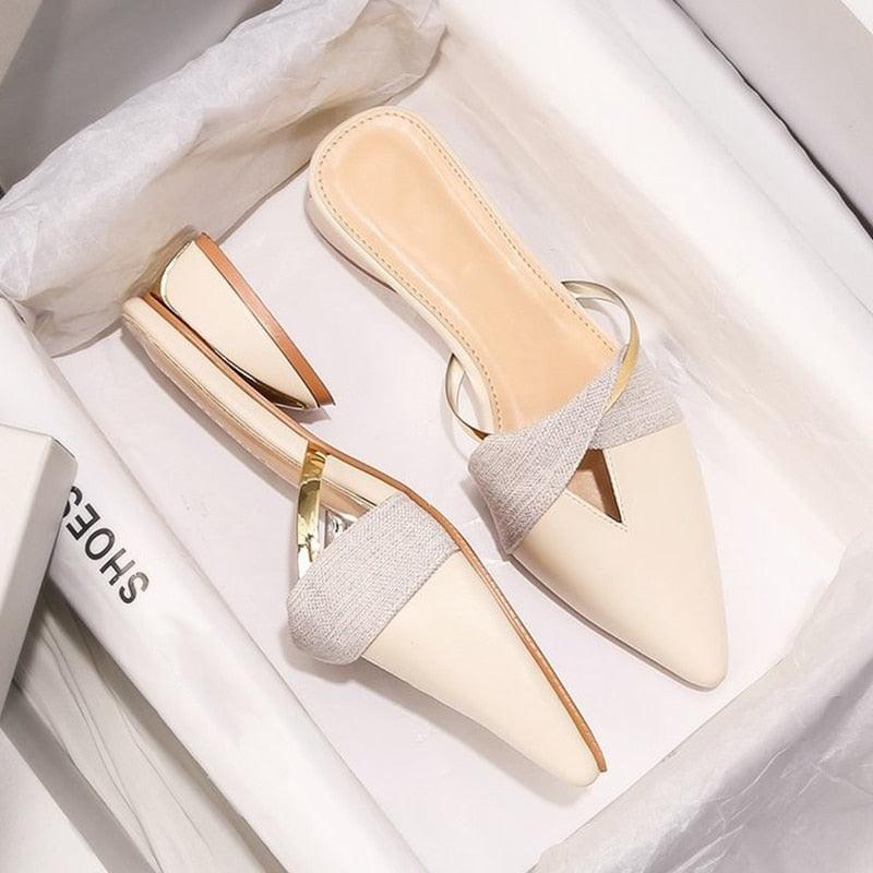 Women's minimalist pointed-toe backless low heel slip-on loafers in a sleek, elegant design.