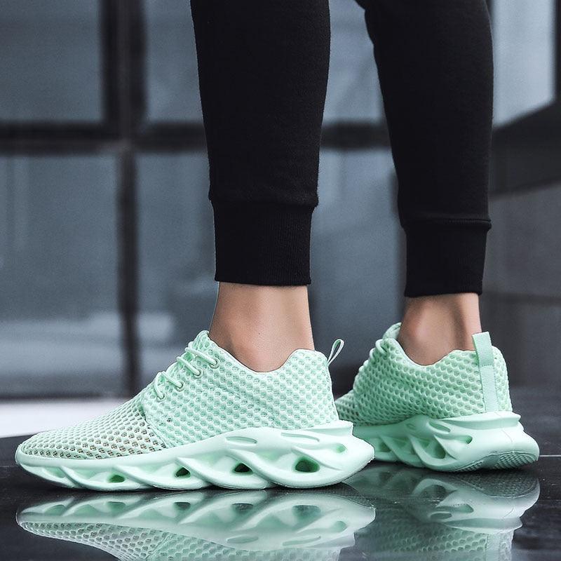 A pair of modern white breathable mesh sneakers with platform soles for athletic and casual wear.