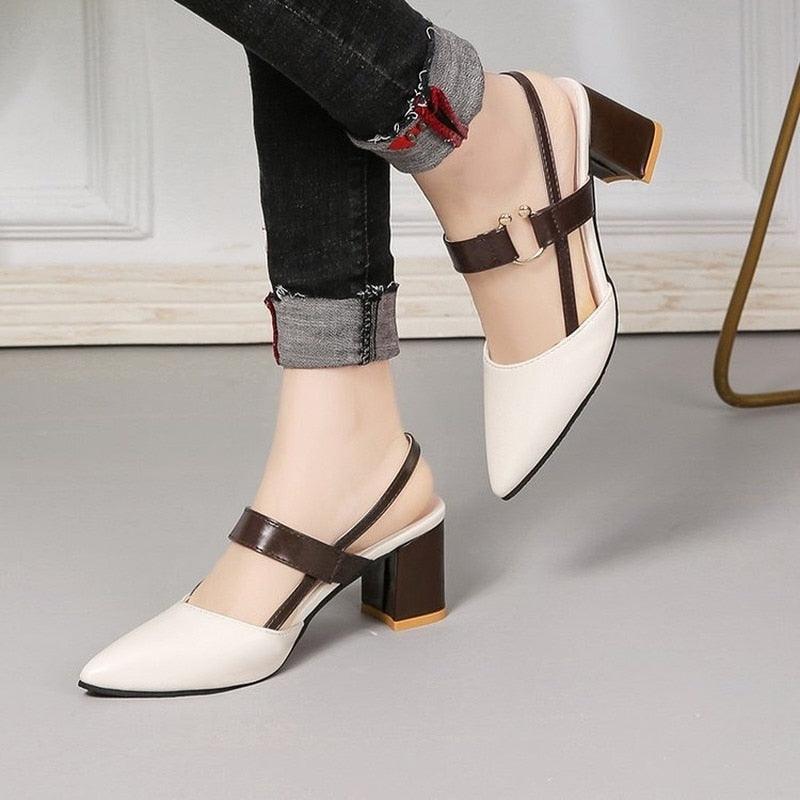 Minimalist women's leather pointy-toe mules in beige and brown.