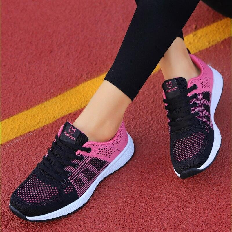 Women's athletic mesh sneakers with heart logo detail in pink, grey, and black