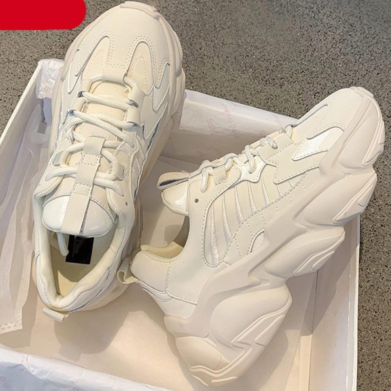 Elegant leather platform sneakers for women in black and white color options.