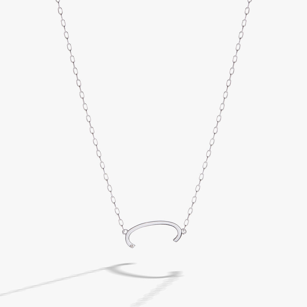 Initial C sideways pendant necklace in gold vermeil on a delicate chain