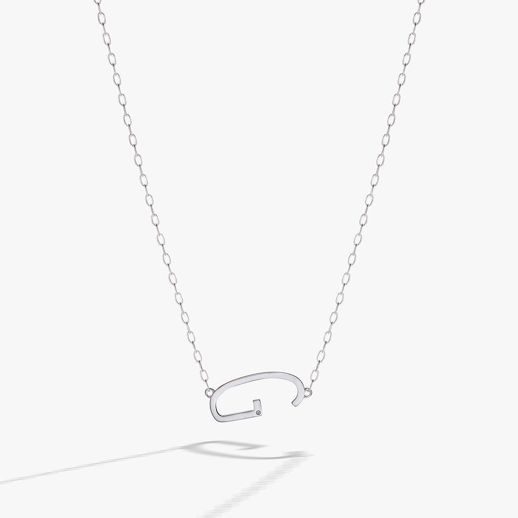 Initial G elongated sideways pendant necklace with cubic zirconia accent on a delicate chain