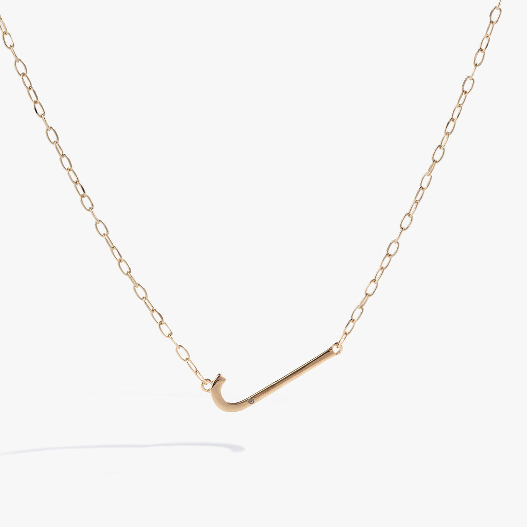 Initial J elongated pendant necklace with white CZ accent in gold vermeil on a delicate chain