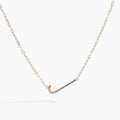Initial J elongated pendant necklace with white CZ accent in gold vermeil on a delicate chain