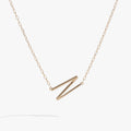 Sideways initial N pendant necklace in gold vermeil with cubic zirconia accent