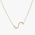Sideways Initial S pendant necklace featuring a white CZ stone on a delicate gold chain