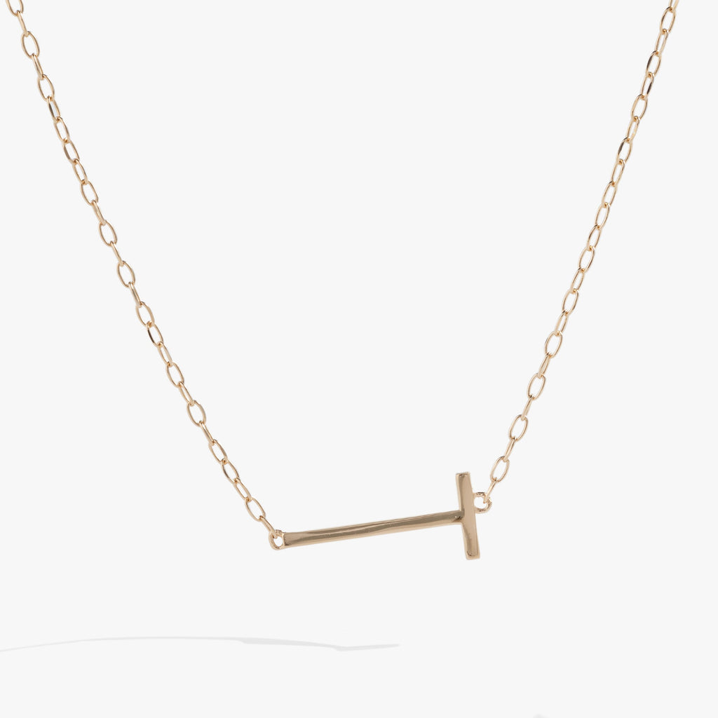 Sideways initial T pendant necklace crafted in sterling silver with sparkling stone