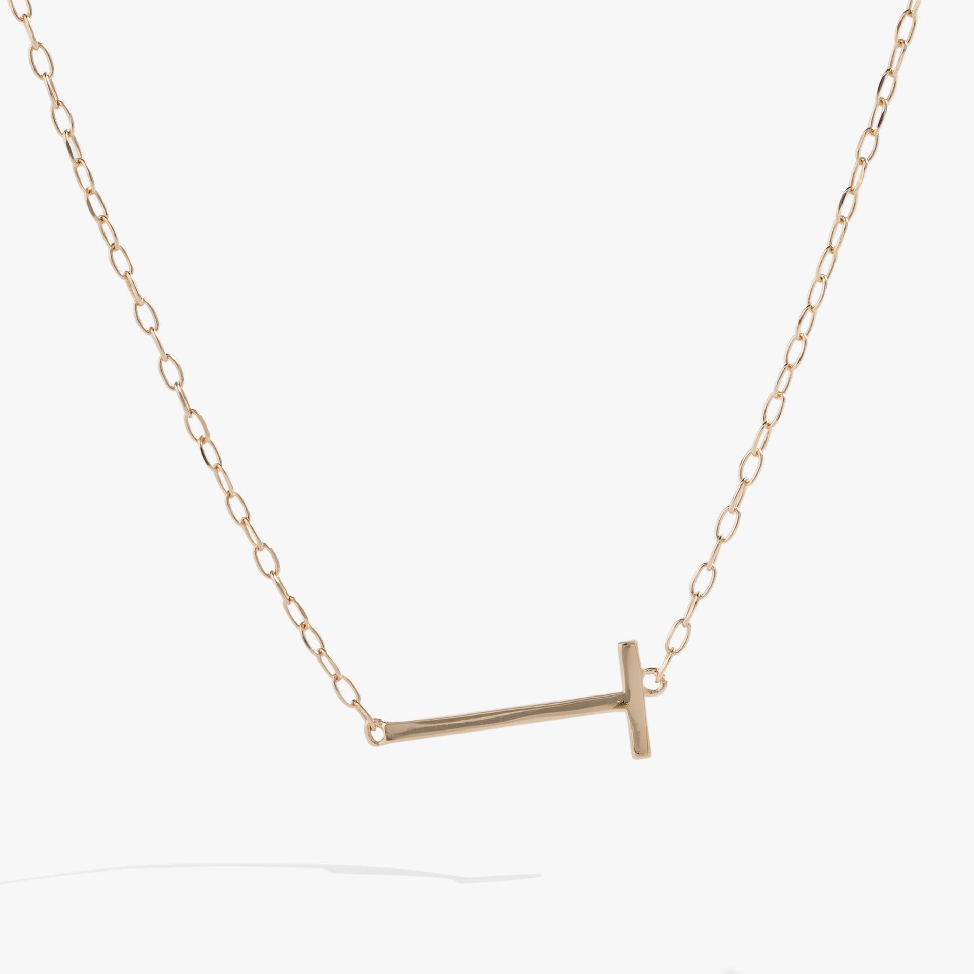 Sideways initial T pendant necklace crafted in sterling silver with sparkling stone
