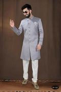 A stylish grey woven jacquard kurta paired with white pyjamas for boys