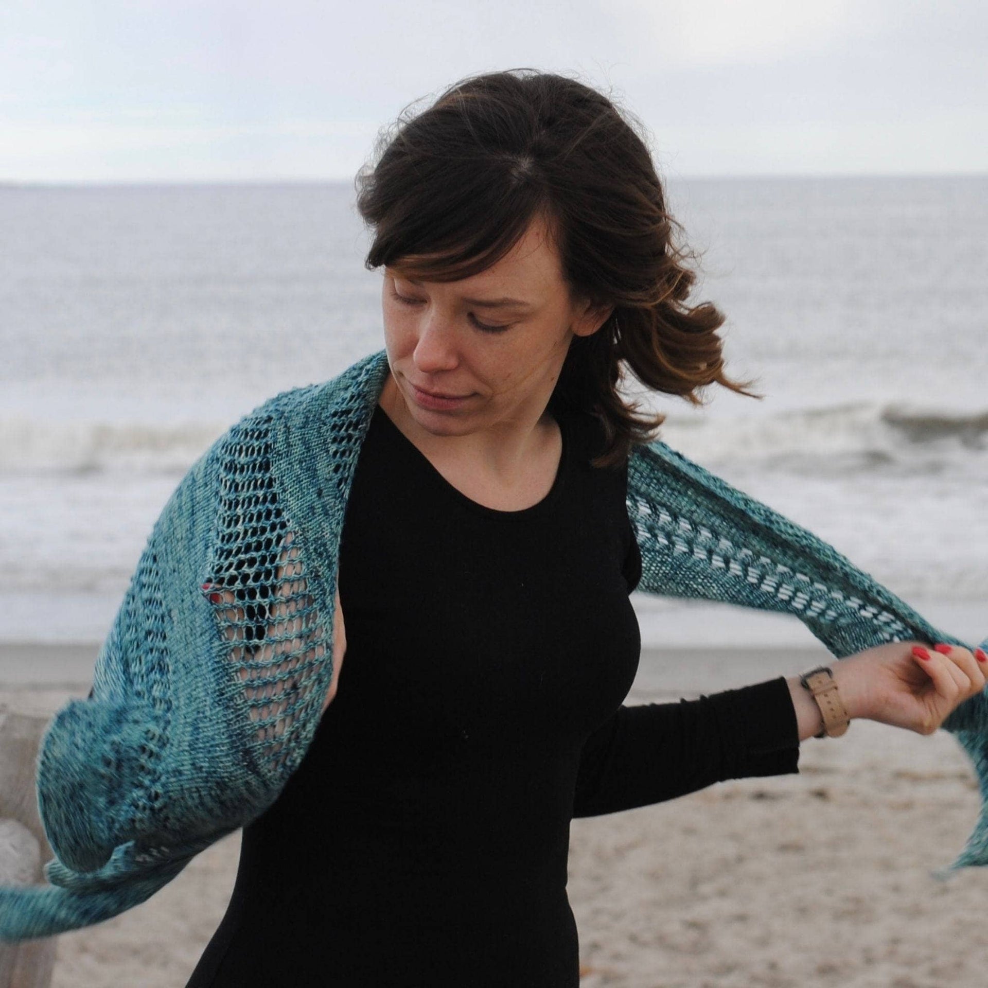 Close-up of the Emerald Bay Shawl knitting pattern showing delicate lace and stockinette textures