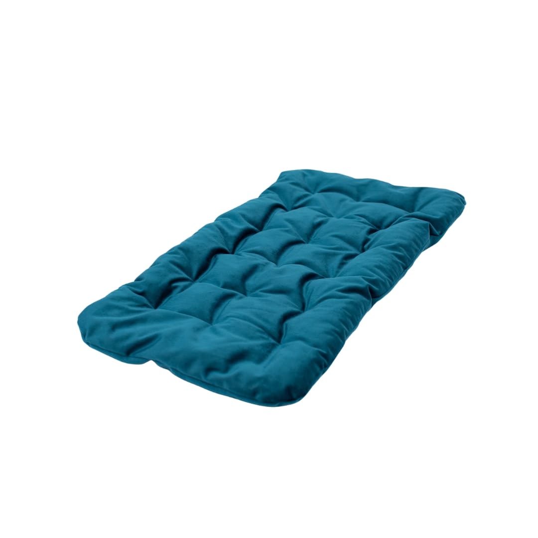 Emerald colored plush sleeping pillow for cats resting on a soft surface