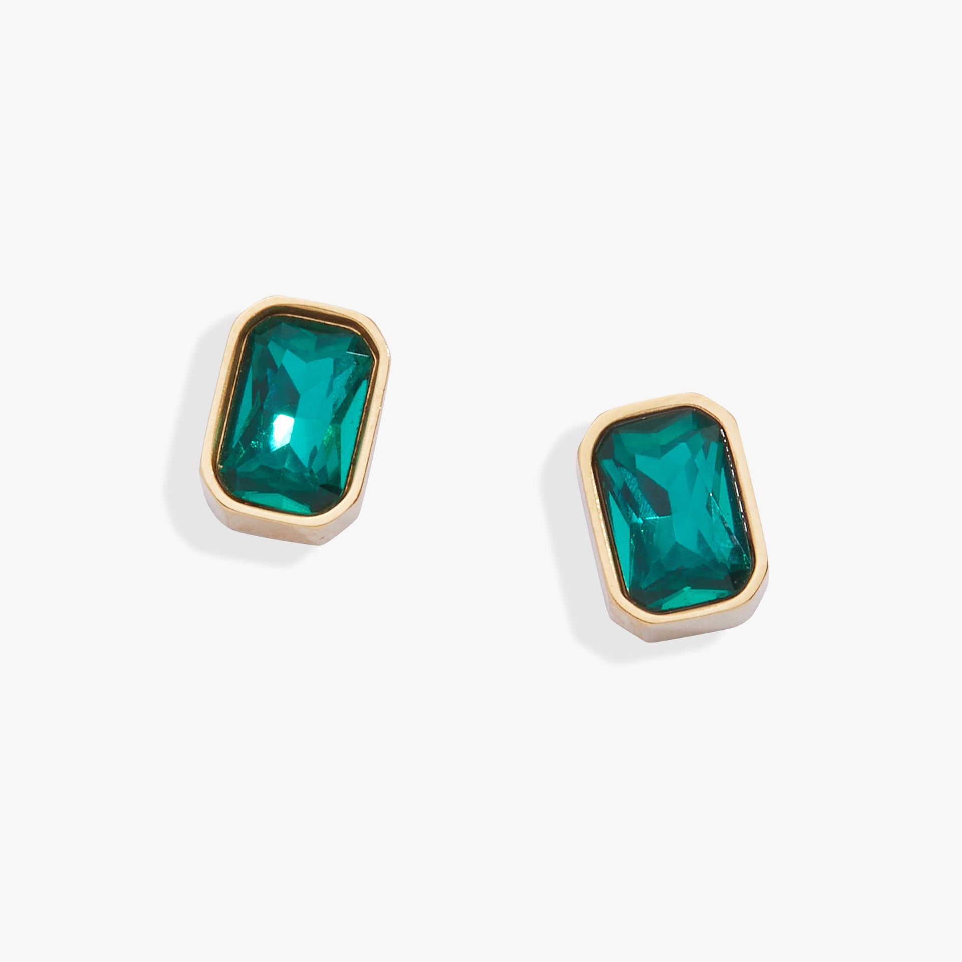 Pair of emerald-cut blue zircon glass stud earrings in a sleek bezel setting