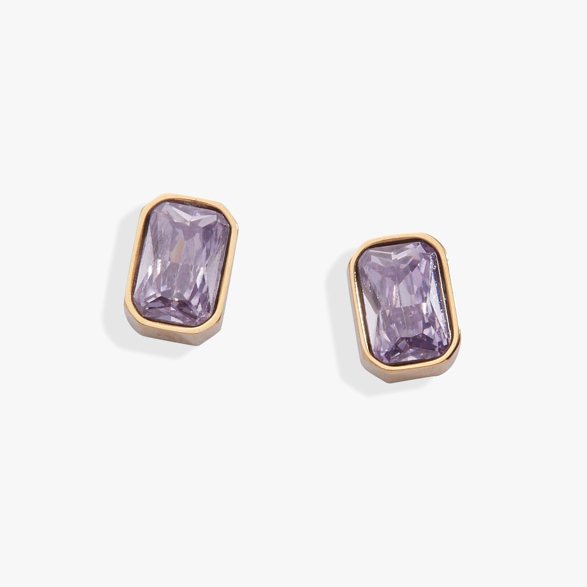 Elegant June birthstone earrings with light amethyst emerald-cut glass in a bezel setting.