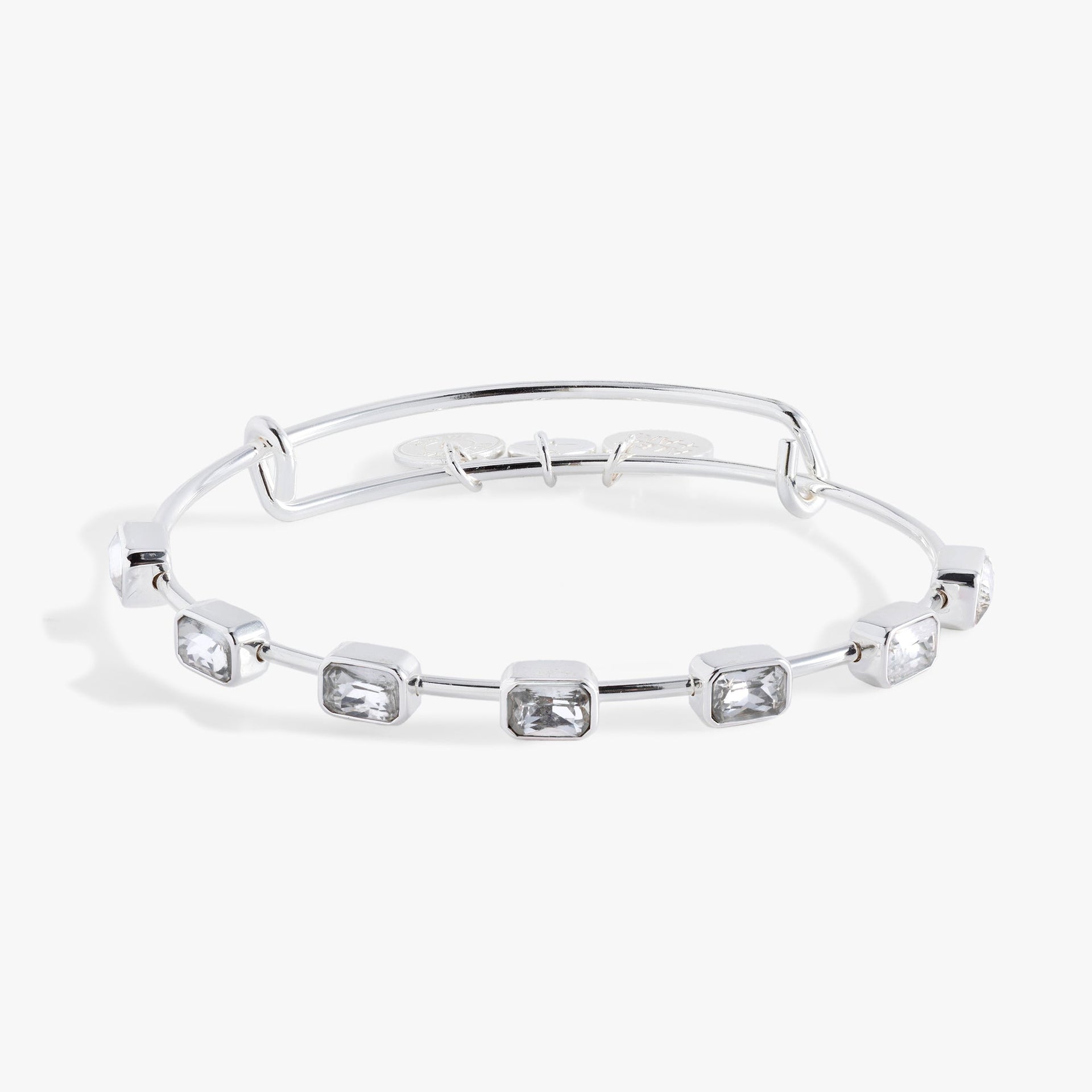 April Birthstone Bangle featuring seven emerald-cut clear crystals on an expandable wire band.