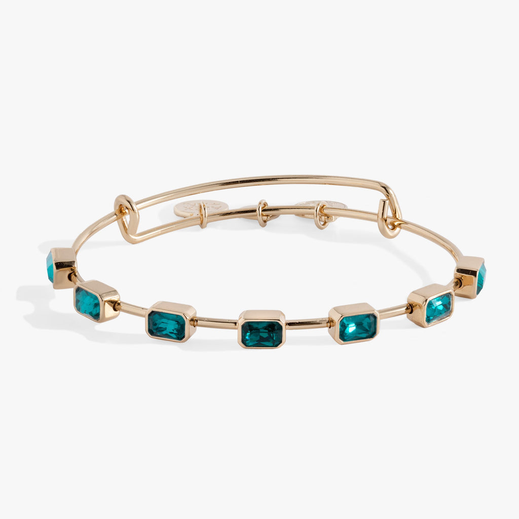 December birthstone expandable wire bangle with seven emerald-cut blue zircon-colored crystals
