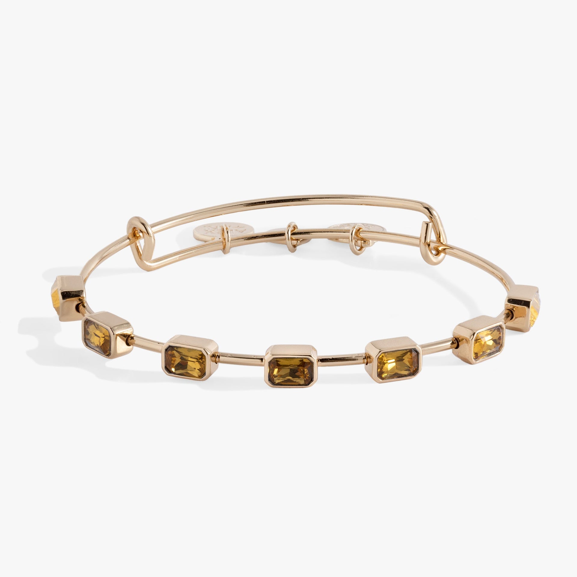 November Birthstone Bangle featuring seven emerald-cut gold crystals on an expandable wire band.