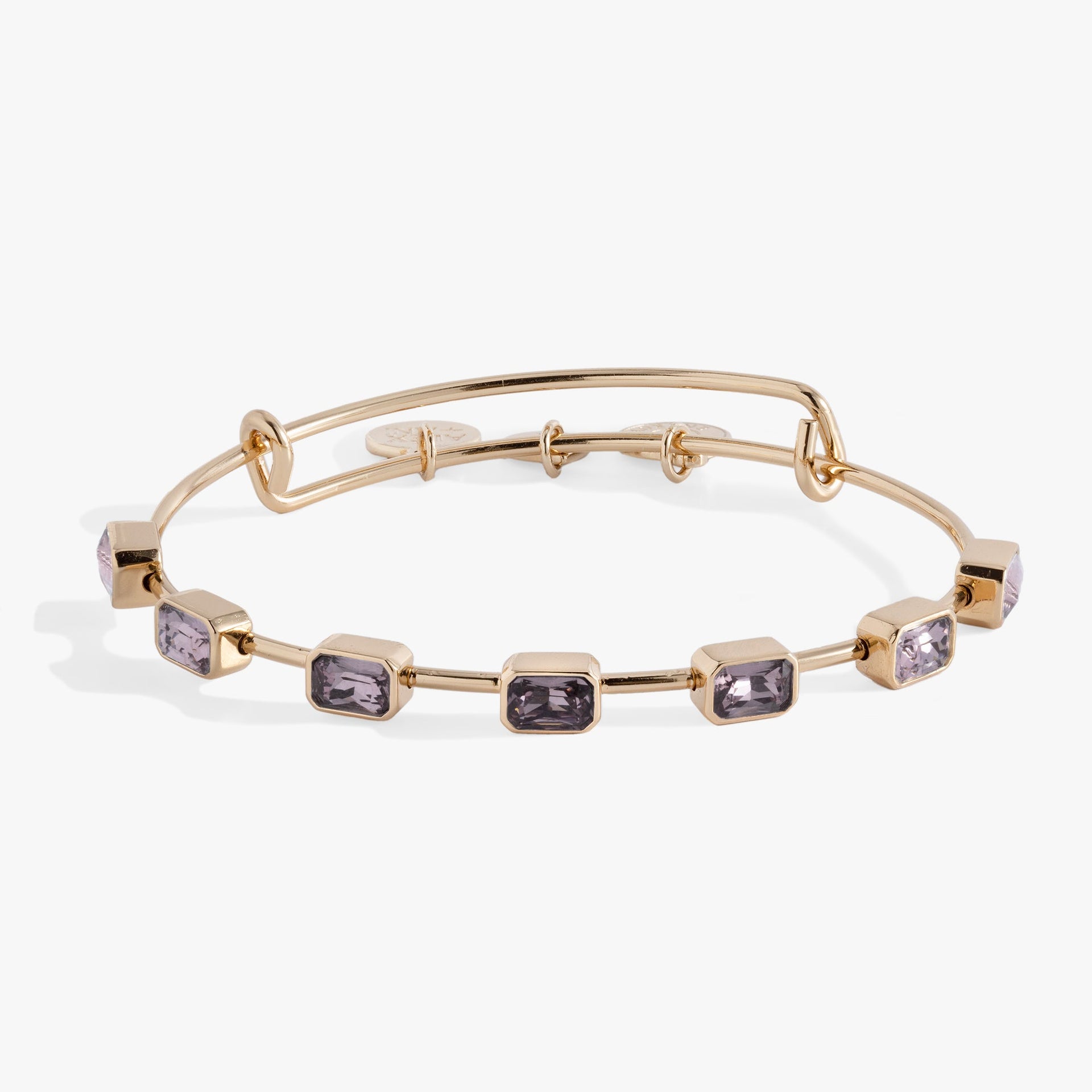June birthstone bangle featuring seven light amethyst emerald-cut crystals on an expandable silver-tone wire.