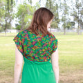 Close up of the Emerald Pools Bolero Jacket crochet pattern detail showing intricate lace weight silk stitch work.