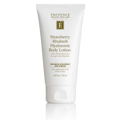 Bottle of Eminence Strawberry Rhubarb Hyaluronic Body Lotion in white and gold packaging