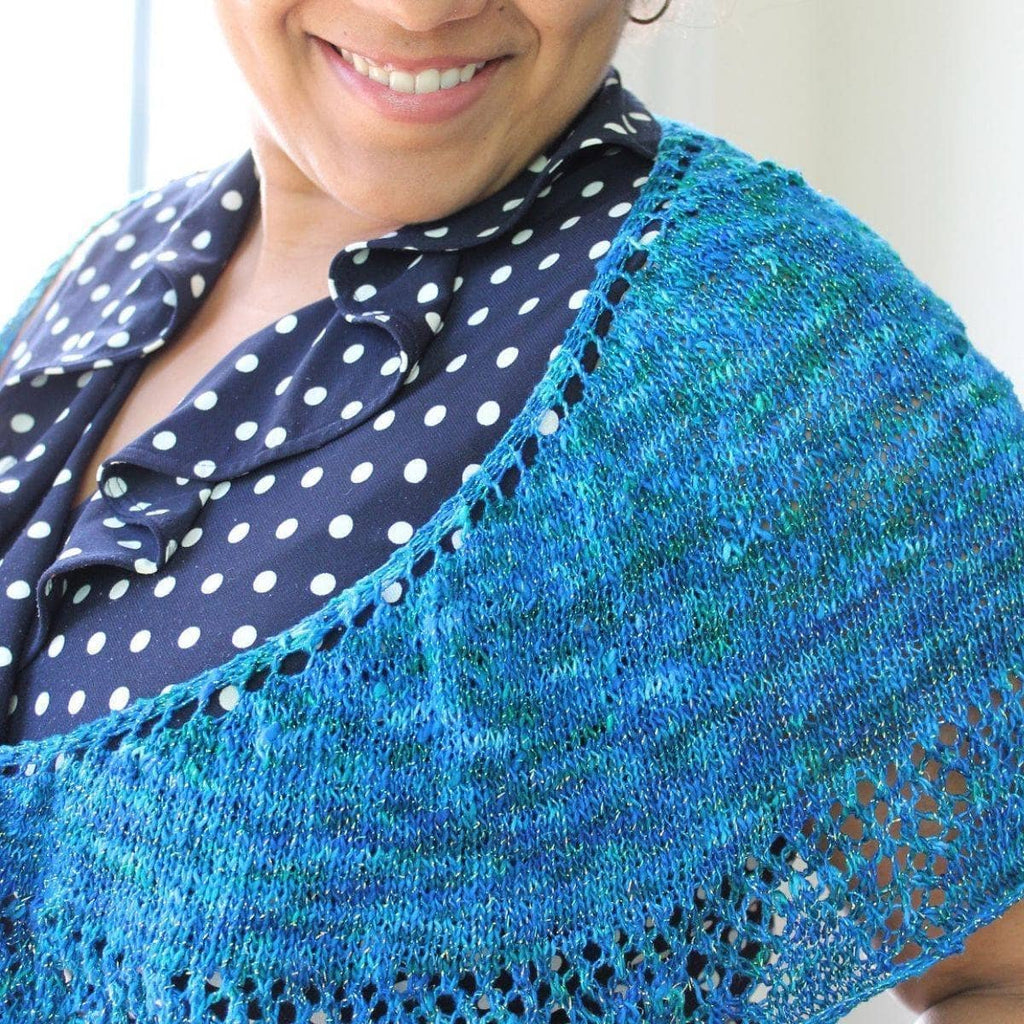 Intermediate level lace shawl in blue and teal silk yarn