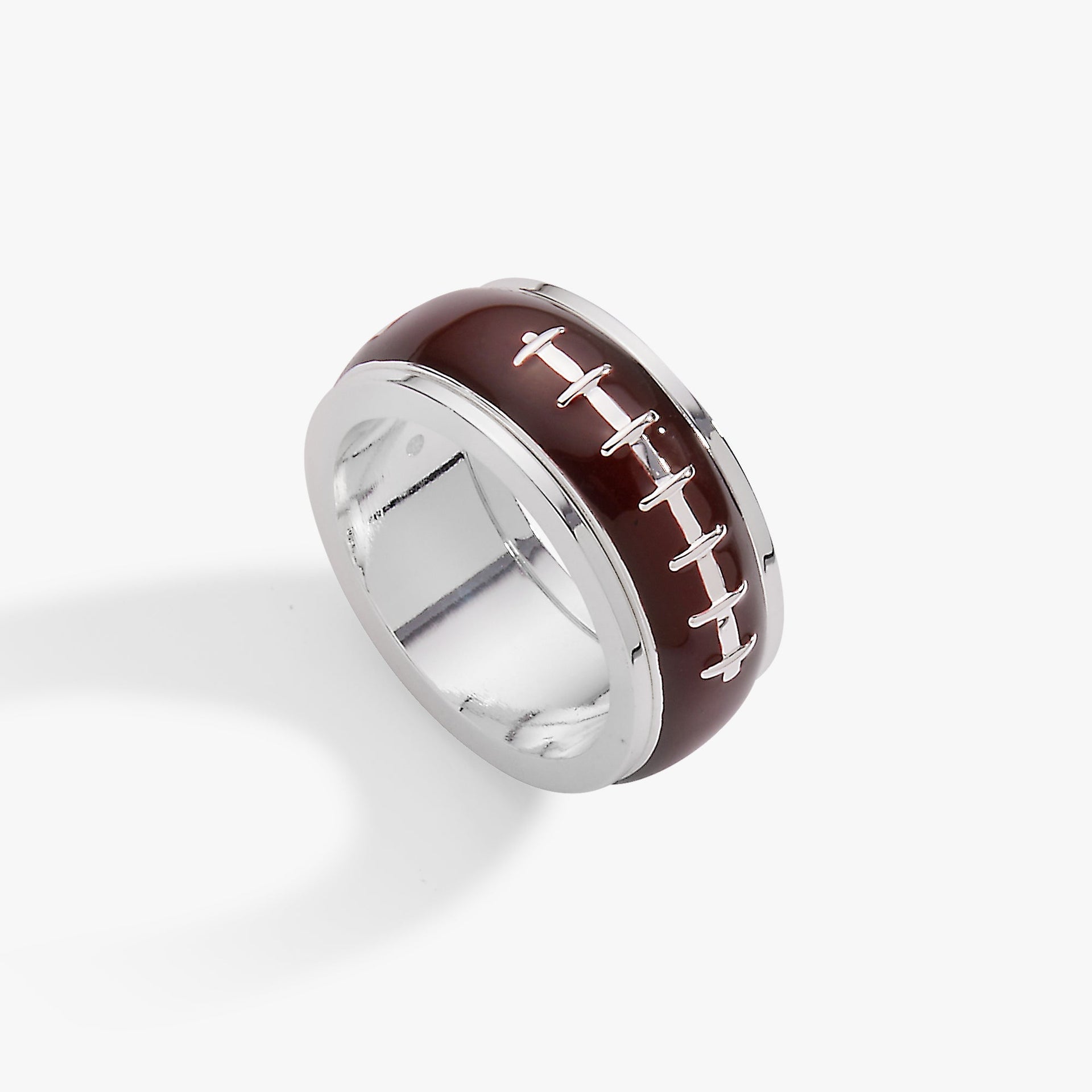 Close up of an enamel football fidget ring with spinning detail