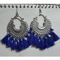 Handcrafted royal blue thread earrings with glass pearl details.