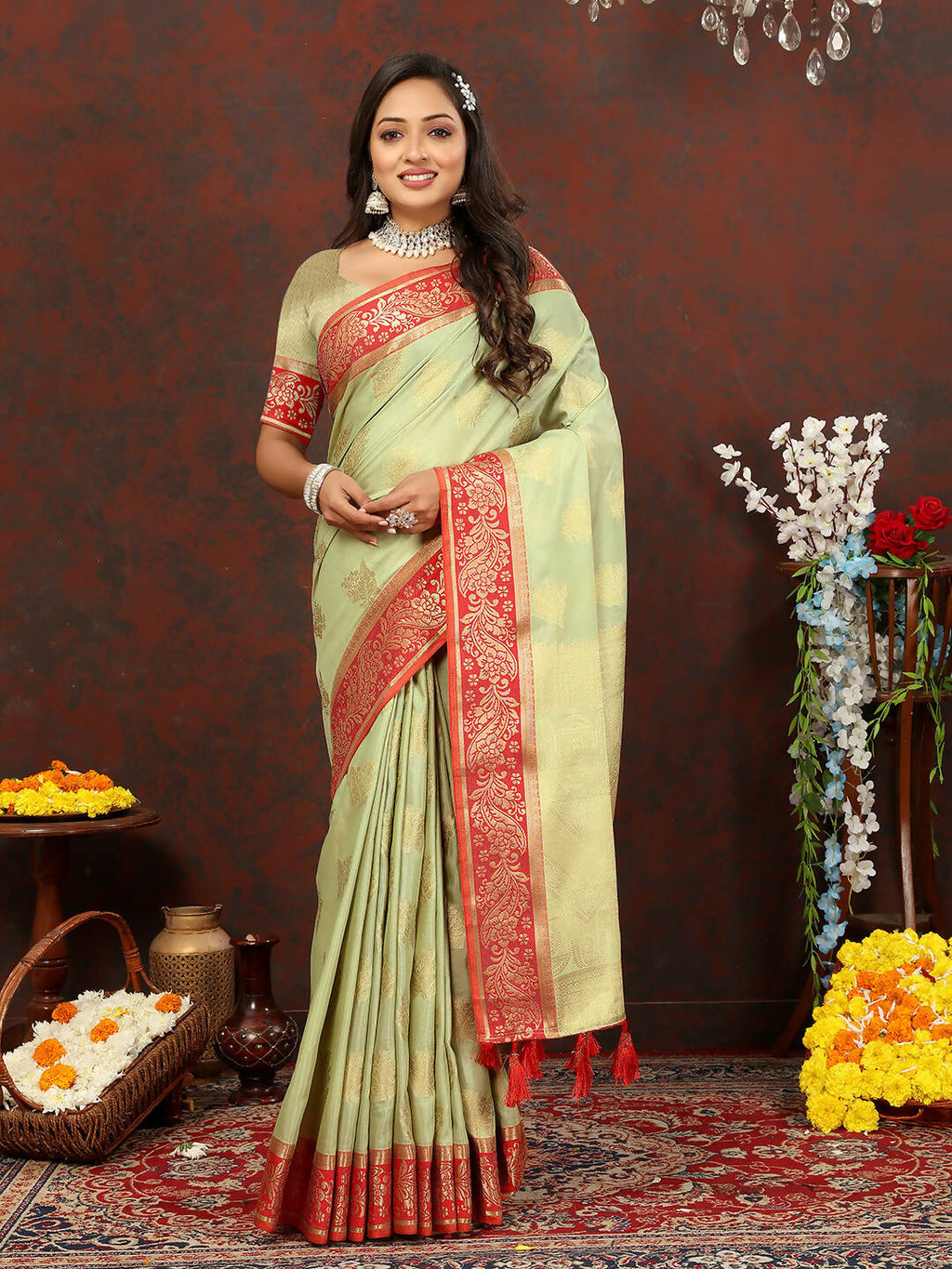Seagreen cotton saree with gold zari weaving, red border accents, and silk blouse.