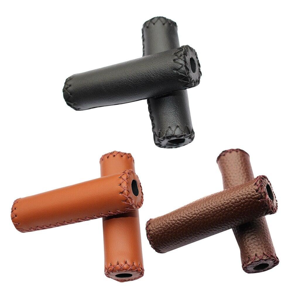 Close up of ergonomic retro-style PU leather bicycle handle grips on mountain bike handlebars