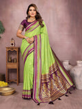 Vibrant Parrot Green Kalamkari Silk saree with detailed weaving patterns.