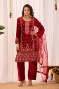 Model wearing a red velvet readymade kurta set with detailed embroidery and sequence work.