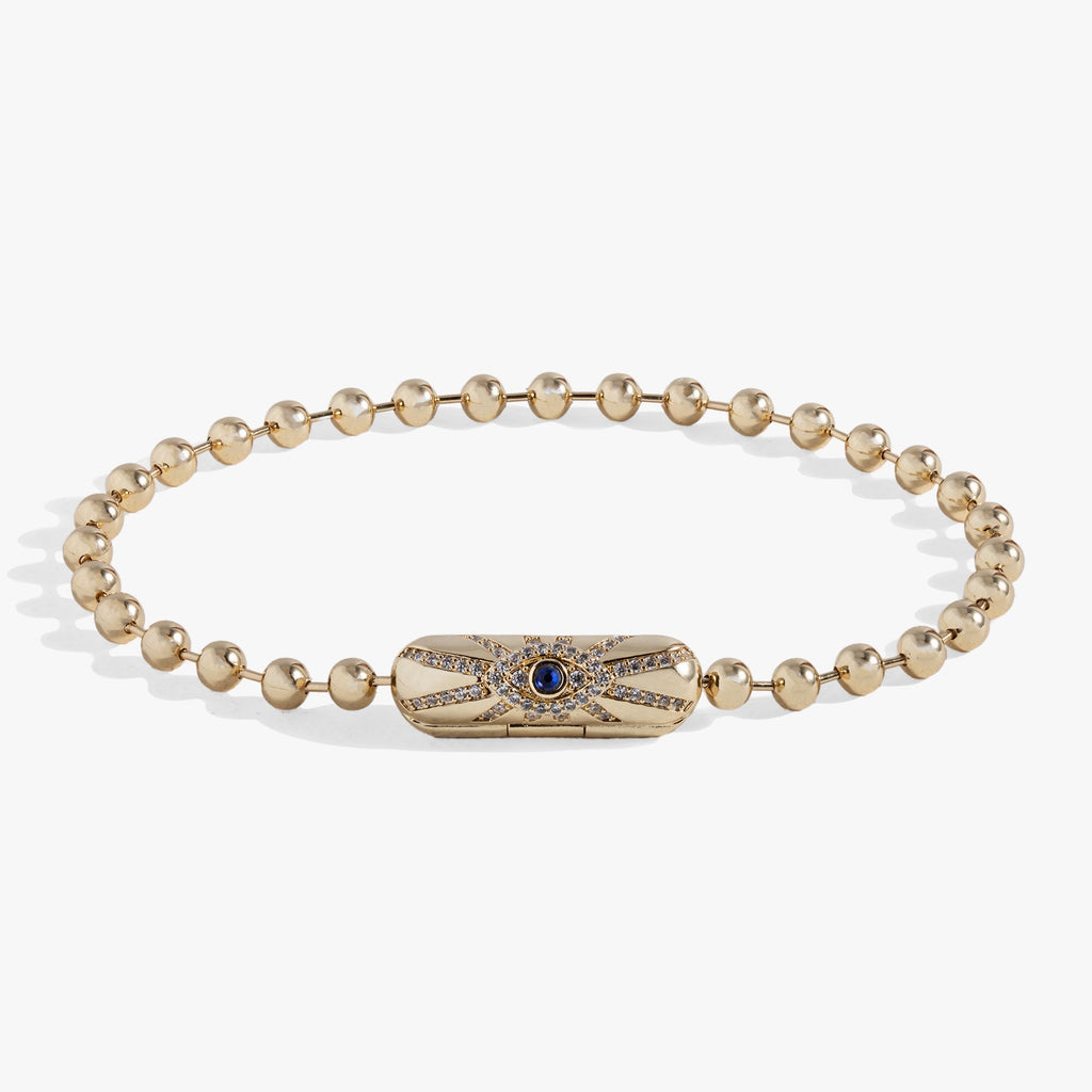 Modern minimalist ball chain bracelet with a magnetic barrel closure and a crystal evil eye charm.