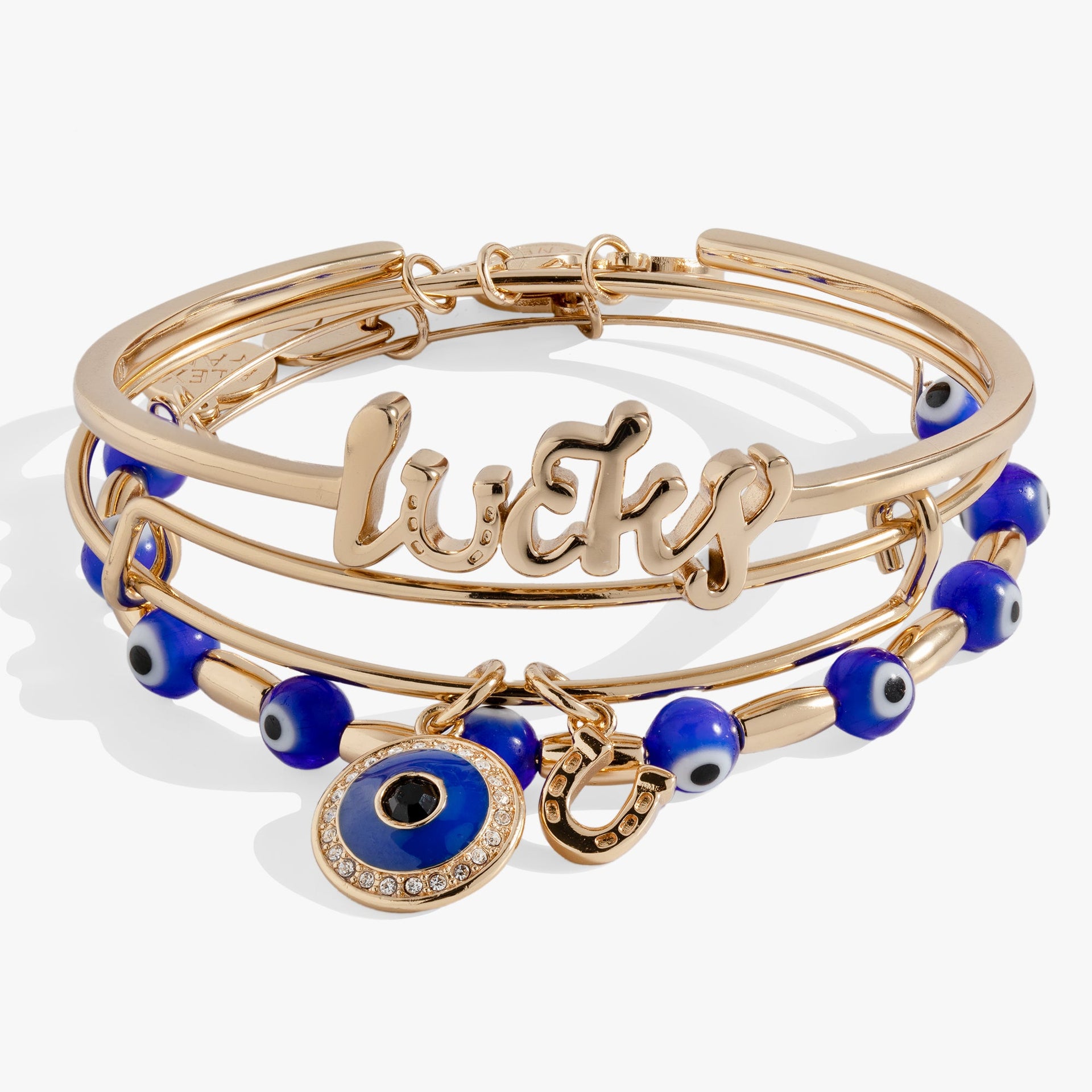 Set of three evil eye bangles including a Lucky cuff and charm bracelets with horseshoe and crystal details