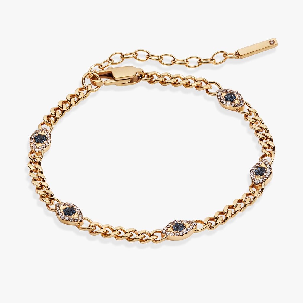 Gold-tone curb chain bracelet with inline evil eye motif featuring blue and clear crystals.