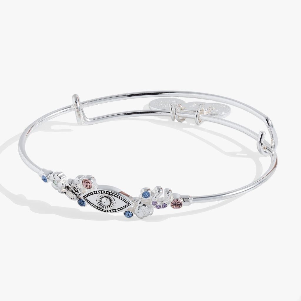 Silver-tone evil eye bangle with lucky charms and colorful crystal accents.