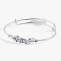 Silver-tone evil eye bangle with lucky charms and colorful crystal accents.