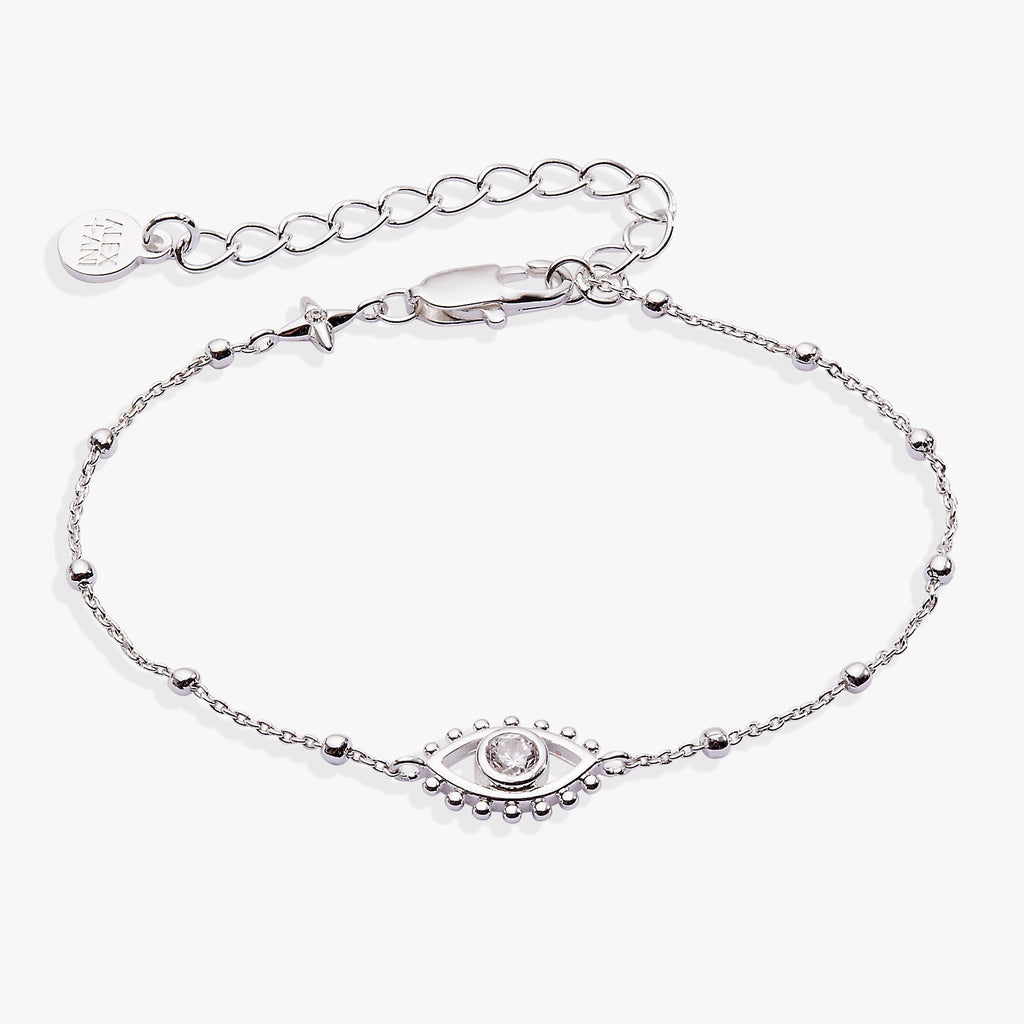 Silver-plated evil eye charm on a beaded chain bracelet