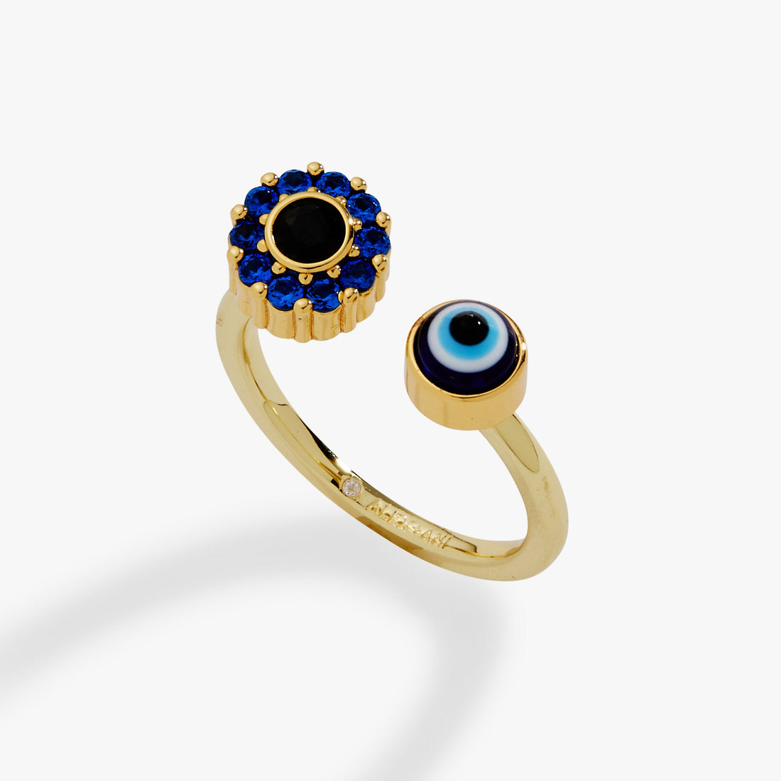 Close-up of a gold fidget spinner ring featuring a spinning pave evil eye with sapphire crystals and a jet center stone.
