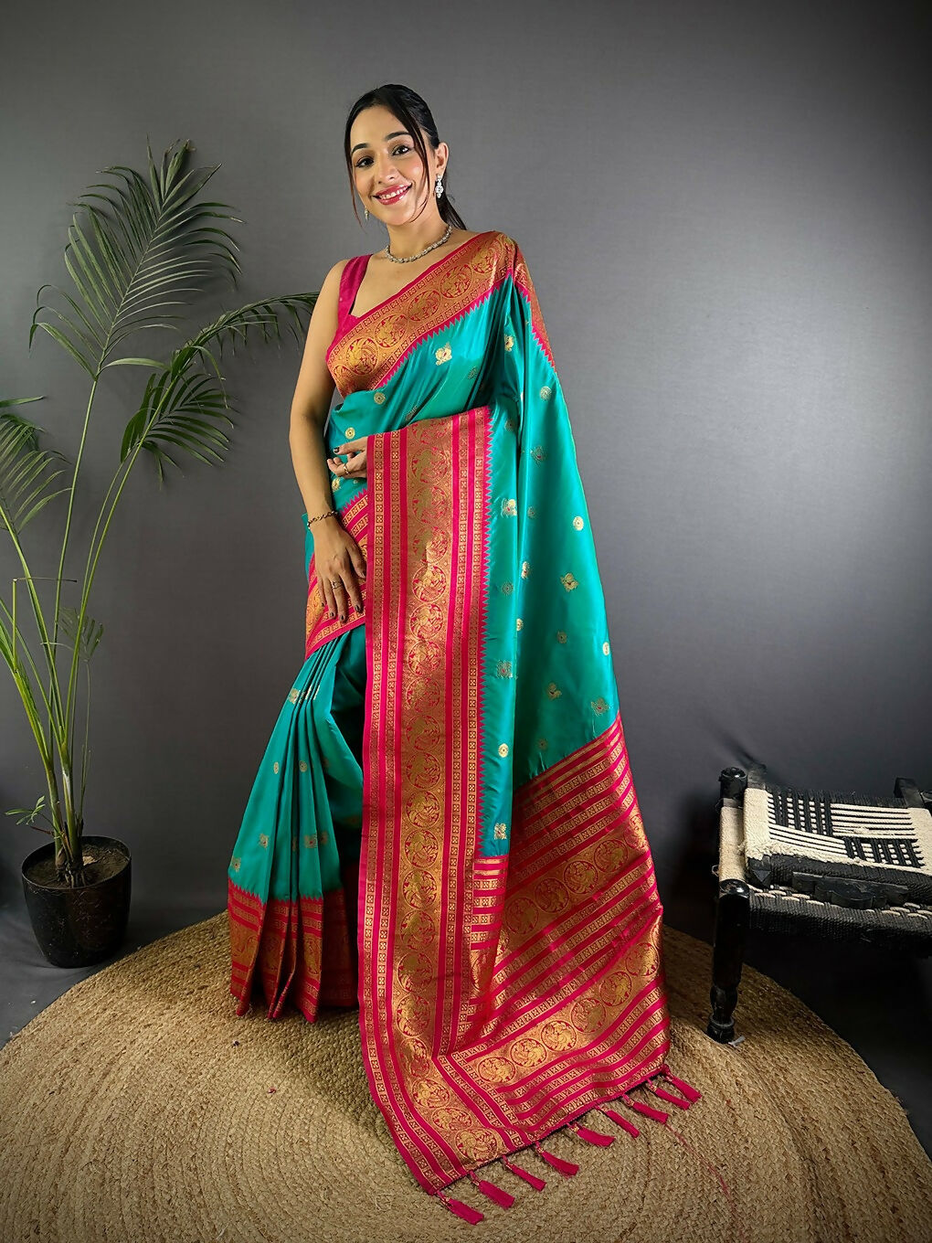 Turquoise Banarasi soft silk saree featuring traditional woven patterns and coordinating blouse piece