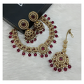 Stunning wine-colored stone work necklace set with matching earrings.