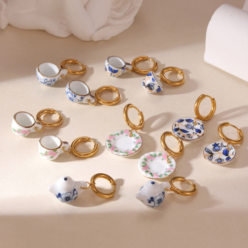 Close-up of elegant Chinese blue and white porcelain drop earrings with 18K gold-plated hardware