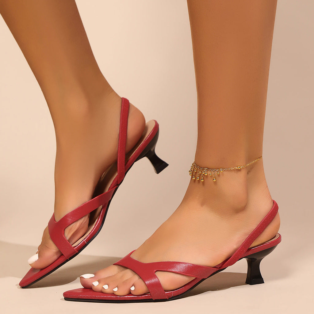 Women wearing stylish pointed toe low heel sandals in red, black, and leopard print