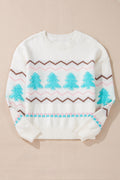 White long-sleeve sweater with a festive blue tree design and brown and pink chevron stripes, featuring ribbed collar and hem.