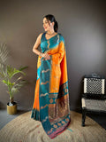 Teal silk saree with peacock and butti detailing, paired with unstitched blouse piece.