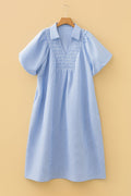 Blue and white striped cotton midi dress featuring a shirred V-neck collar and puff sleeves.