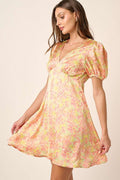 Floral satin mini dress with puff sleeves and ruched details in pink, yellow, and light-green