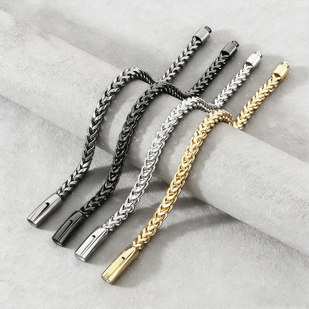 Close-up of a polished stainless steel thick cable chain bracelet for men