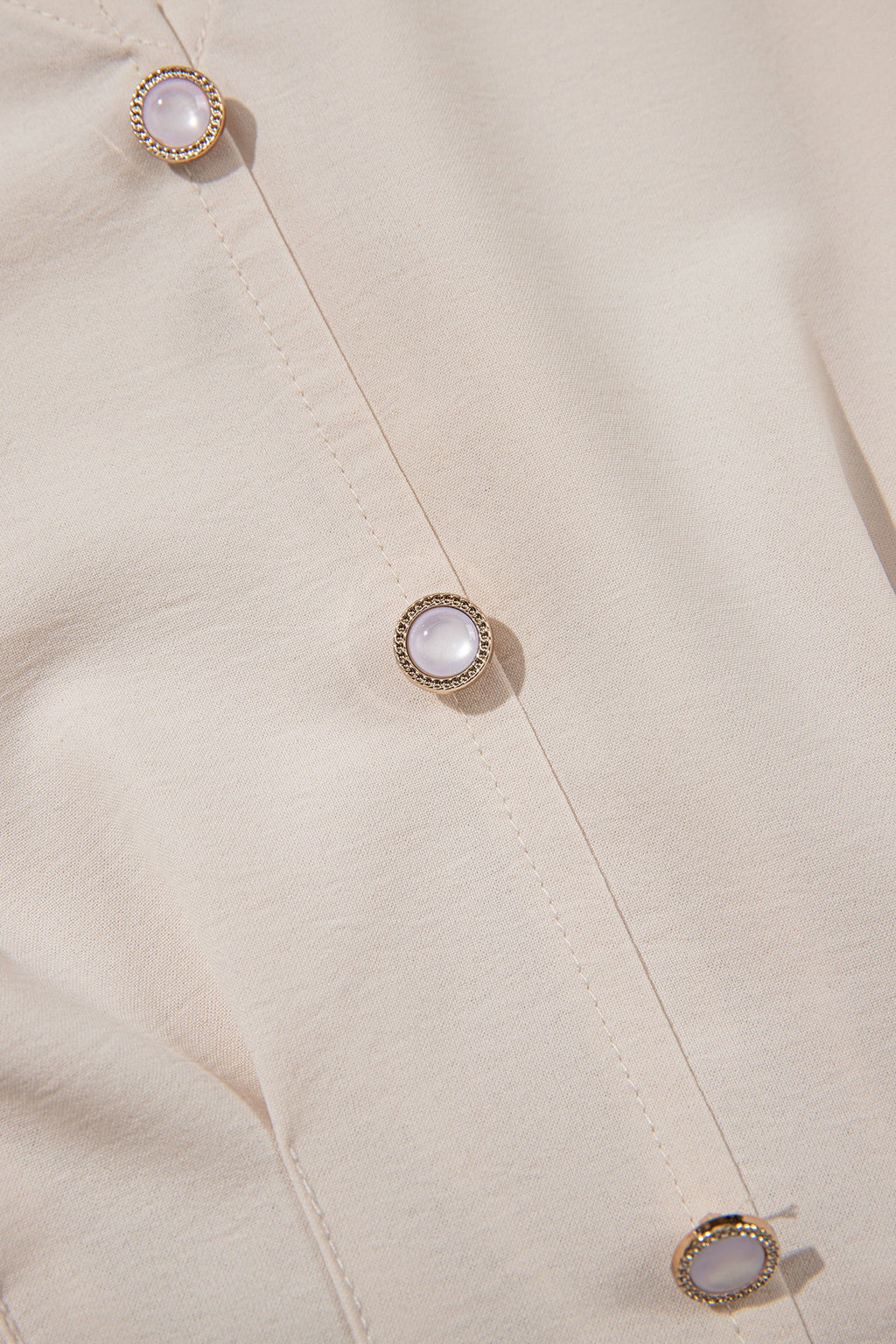 Solid V-Neck Long Sleeve Smocked Waist Peplum Blouse in Beige