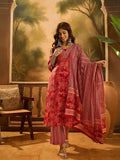 Woman wearing a vibrant red pure cotton printed kurta set with elegant ethnic styling.