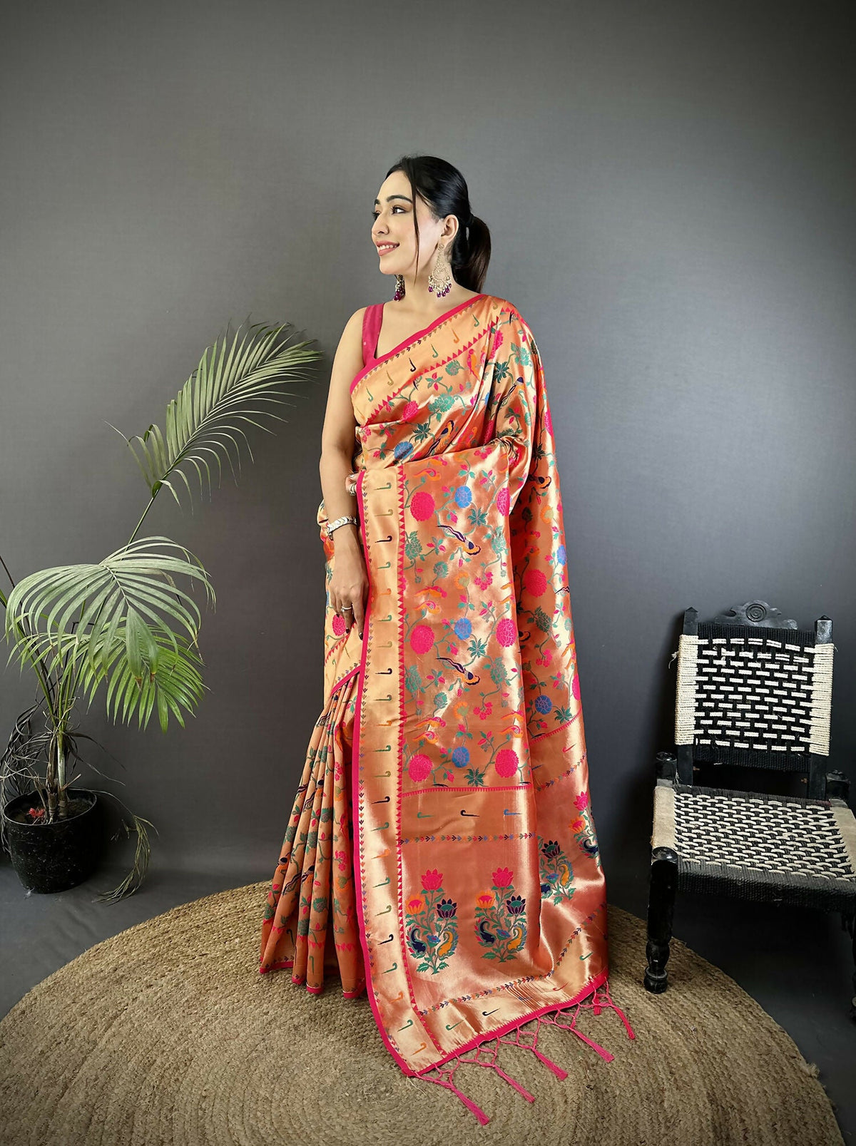 Pastel red soft silk Paithani saree with Mughal-inspired detailing